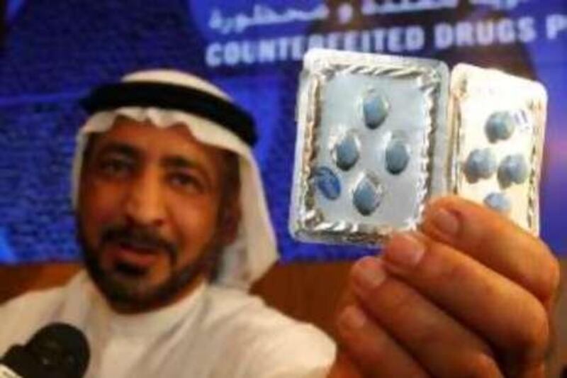 Dubai, 31st May 2010.  Ahmed Butti Ahmed (Director General, Dubai Customs)  shows the genuine and counterfeit drugs, during the press conference, held at the Dubai Customs headquarters.  (Jeffrey E Biteng / The National)  Editor's Note;  Ahmed Butti Ahmed invited one of the media reporter to see which one is fake of the two packs.