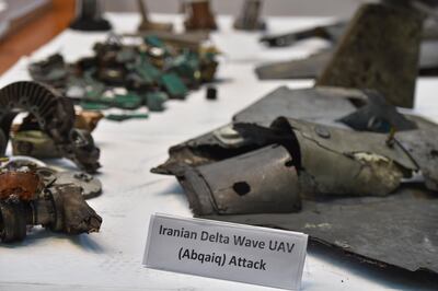 TOPSHOT - A picture taken on September 18, 2019 shows displayed fragments of what the Saudi defence ministry spokesman said were Iranian cruise missiles and drones recovered from the attack site that targeted Saudi Aramco's facilities, during a press conference in Riyadh. Saudi Arabia said that strikes on its oil infrastructure came from the "north" and were sponsored by Iran, but that the kingdom was still investigating the exact launch site. / AFP / Fayez Nureldine
