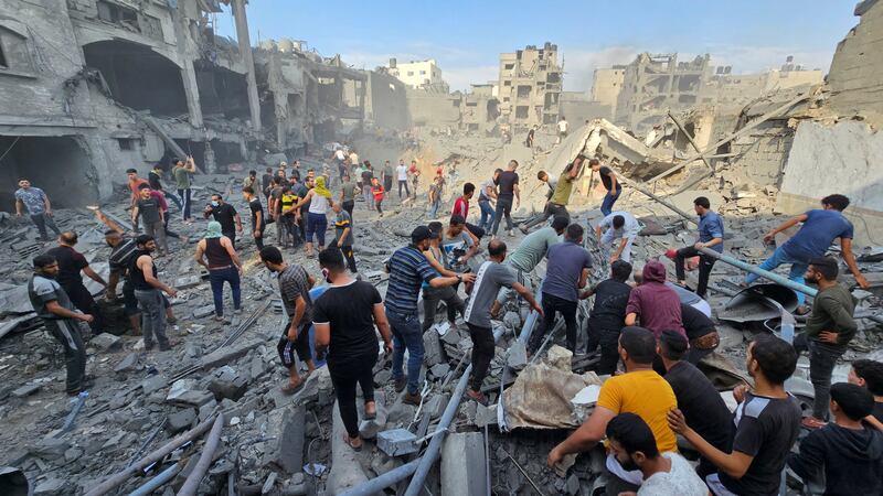 Palestinians search for casualties at the site of Israeli strikes on Jabalia refugee camp in Gaza on October 31. Reuters