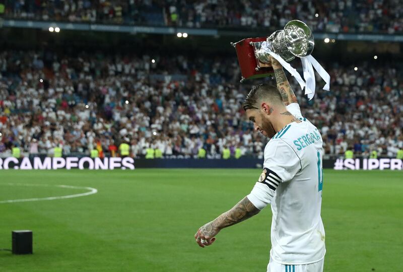 Soccer Football - Real Madrid vs Barcelona - Spanish Super Cup Second Leg - Madrid, Spain - August 17, 2017   Real Madrid's Sergio Ramos celebrates with the trophy after winning the Spanish Super Cup   REUTERS/Juan Medina