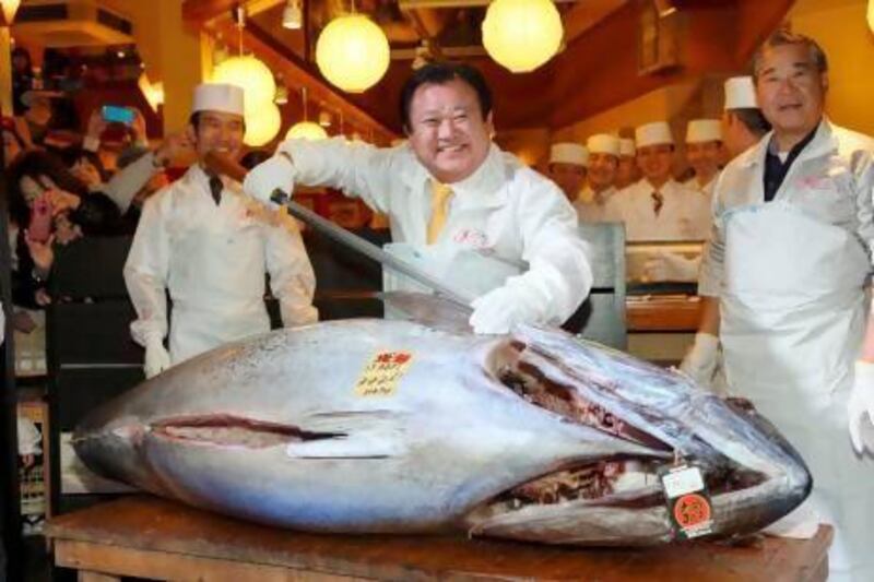 A bluefin tuna sold for a record ¥155.4 million (Dh6.4m) at a Tokyo auction yesterday. EPA / KIMIMASA MAYAMA