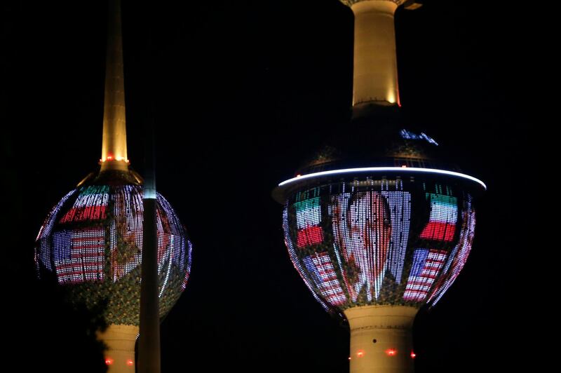 Kuwait Towers in Kuwait City are illuminated in the colours of the American flag and a portrait of former US president George HW Bush in tribute to the former US president.  AFP