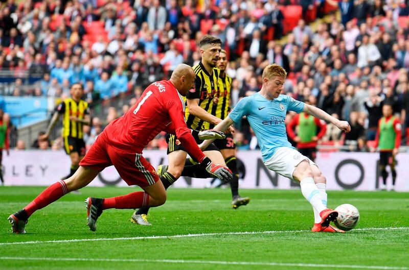 Kevin de Bruyne, right, of Manchester City beats goalkeeper Heurelho Gomes of Watford to score and make the score 3-0. EPA