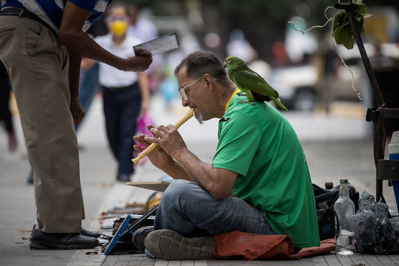 A man plays a flute in Caracas, Venezuela. EPA