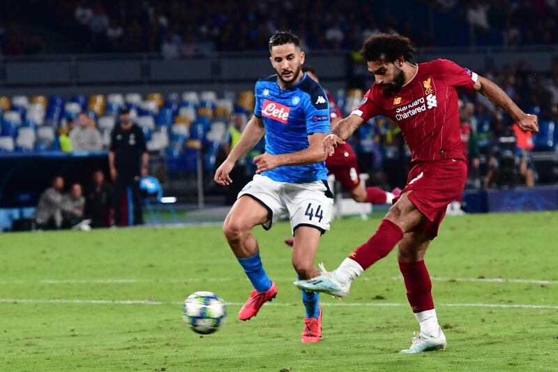 Napoli's Kostas Manolas and Liverpool's Mohamed Salah in action. EPA