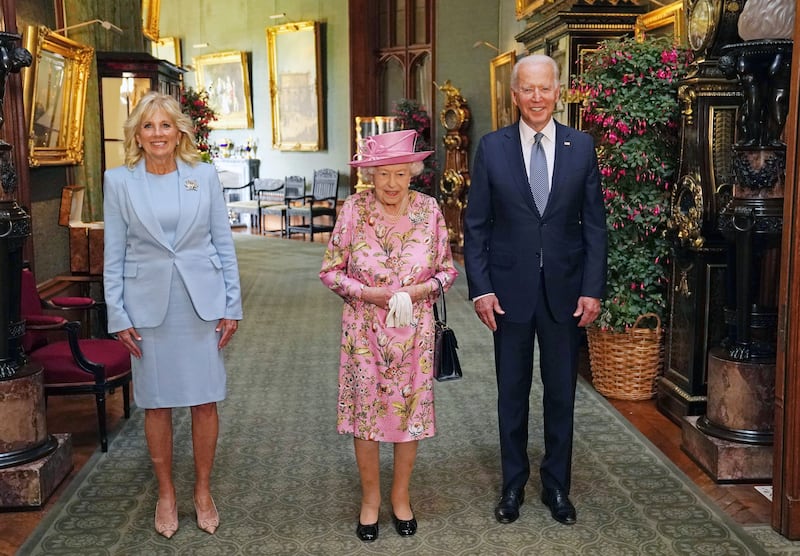 Queen Elizabeth with US President Joe Biden and Jill Biden, the first lady, in the Grand Corridor during their visit to Windsor Castle in June.