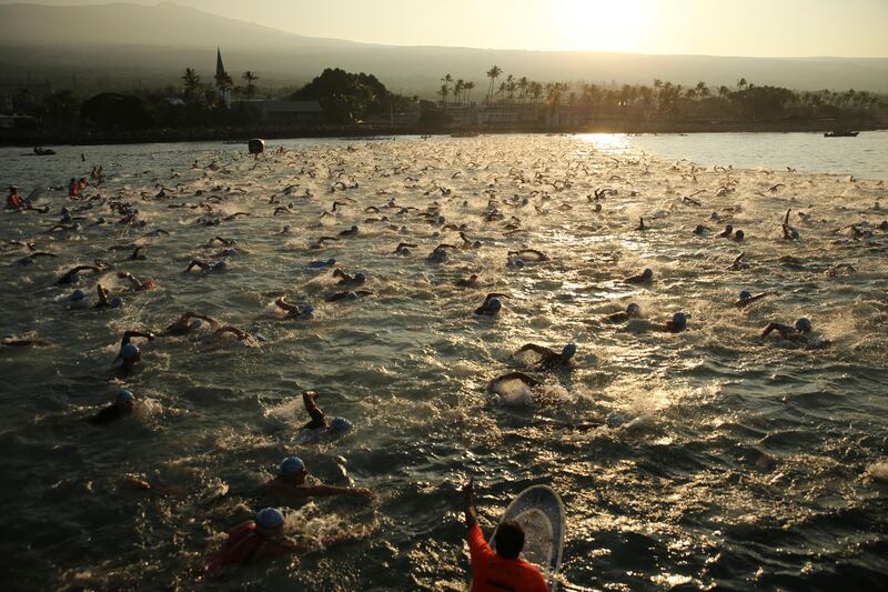 Athletes start the swim race at the Ironman World Championship Triathlon in KaIlua-Kona, Hawaii. Marco Garcia / AP Photo