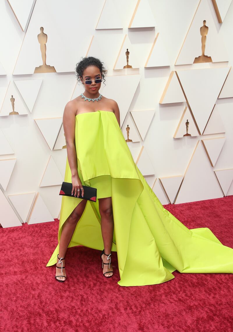 HER, wearing neon yellow Carolina Herrera. AFP