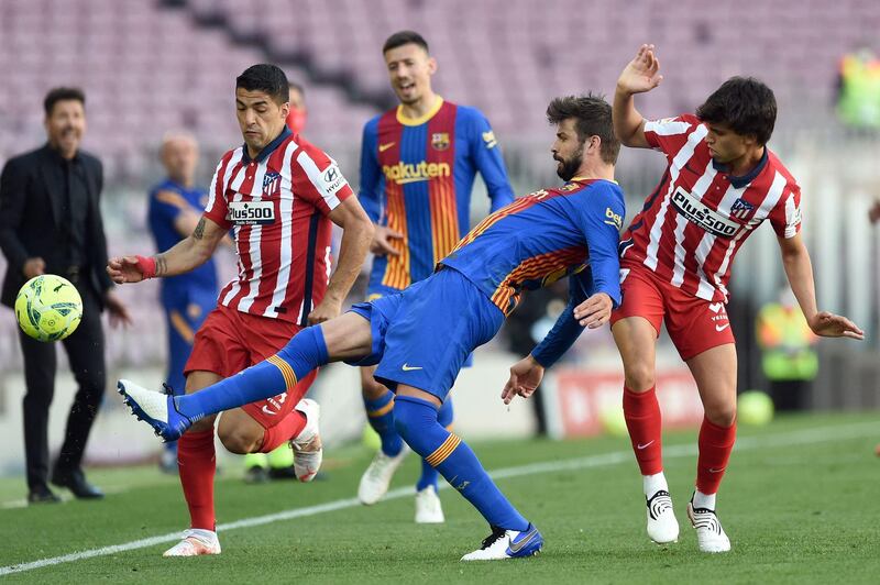 Gerard Pique - 8: Marking a very determined Suarez in the Camp Nou sun. Blocked a Carrasco shot before half time and didn’t mislay a single pass. Headed a Messi ball wide after 63 as Messi – and his team – came to life. Yellow card after 82 after stopping the troublesome trickery of Joao Felix. AFP