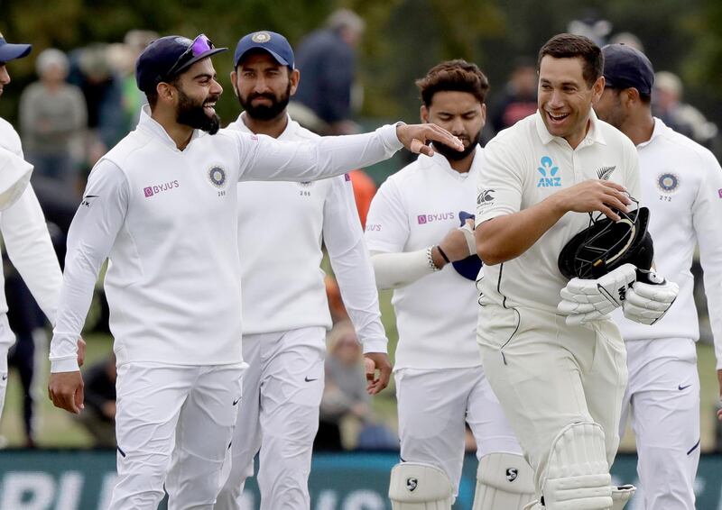 India's Virat Kohli, left, jokes with New Zealand's Ross Taylor after the end of the second Test in Christchurch on Monday. AP