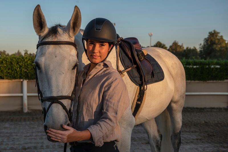 Nadine with her horse Molly, she say's "bonding with a horse takes time and effort. It's a feeling you created between you and your horse. It's about building trust, listening to each other, and being present in the moment” at Al Asayl Stable,Abu Dhabi, UAE, Photography by Vidhyaa Chandramohan