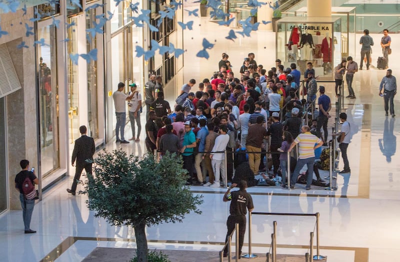 DUBAI, UNITED ARAB EMIRATES, 21 SEPTEMBER 2018 - Crowd at Iphone XS launch at Apple store Dubai Mall.  Leslie Pableo for The National