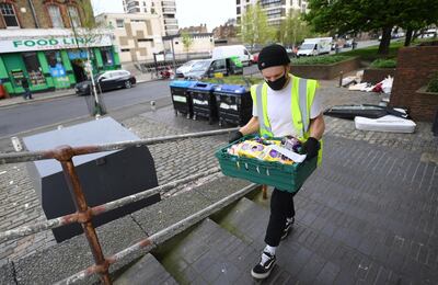epa08369324 An emergency food is delivered to a family at a block of flats in London, Britain, 17 April 2020. Foodbanks have become an essential front-line service in the fight against Coronavirus. With untold numbers of people loosing their jobs and waiting for payments from Universal Credit emergency food deliveries are helping families and the vulnerable get through difficult times. The British government has announced a further three week lockdown due to the Coronavirus pandemic. Countries around the world are taking increased measures to stem the widespread of the SARS-CoV-2 coronavirus which causes the COVID-19 disease.  EPA/ANDY RAIN