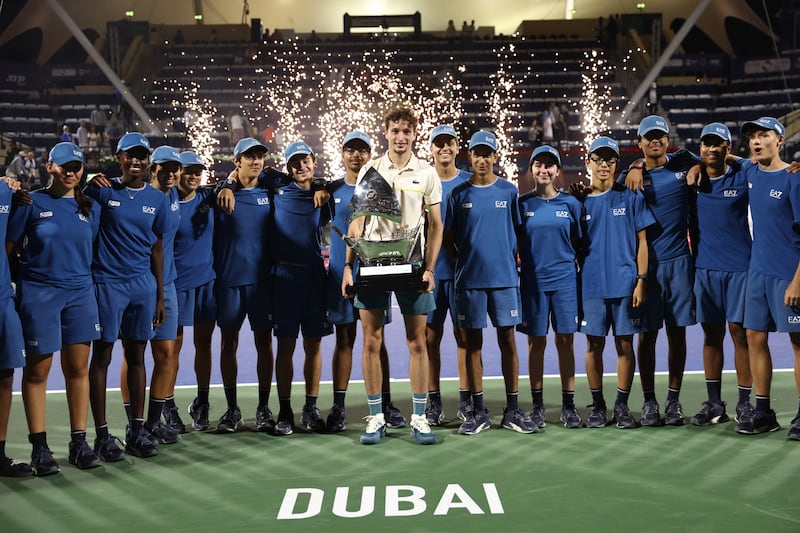 Ugo Humbert poses with the trophy. Reuters