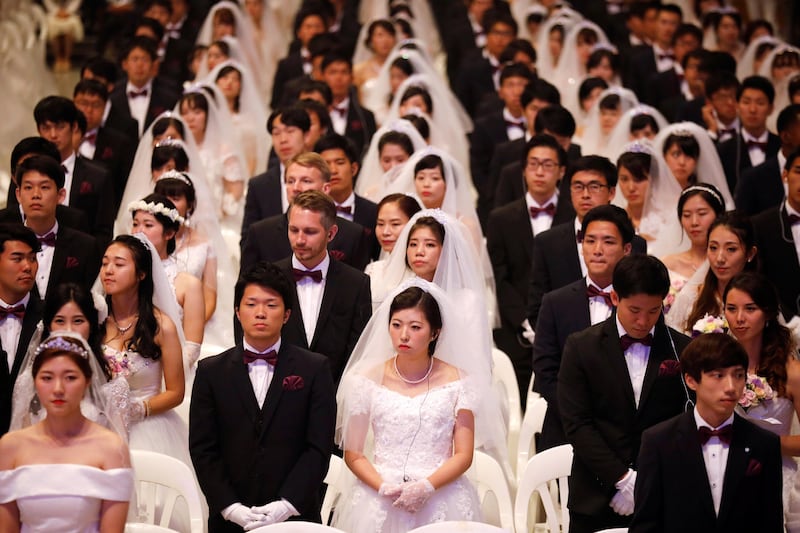 Newlywed couples attend a mass wedding ceremony of the Unification Church at Cheongshim Peace World Centre in Gapyeong, South Korea.  Kim Hong-ji / Reuters