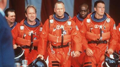 Bruce Willis, Ben Affleck, Will Patton, Steve Buscemi and Michael Clarke Duncan sport Nasa's 'pumpkin' suits in the 1998 space adventure Armageddon. Getty Images / Touchstone Pictures 