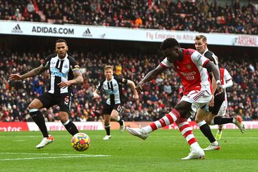 Bukayo Saka (2-R) of Arsenal scores the 1-0 lead during the English Premier League soccer match between Arsenal FC and Newcastle United in London, Britain, 27 November 2021.   EPA/NEIL HALL EDITORIAL USE ONLY.  No use with unauthorized audio, video, data, fixture lists, club/league logos or 'live' services.  Online in-match use limited to 120 images, no video emulation.  No use in betting, games or single club / league / player publications