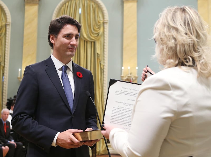 Justin Trudeau is sworn-in as Canada's 23rd prime minister during a ceremony at Rideau Hall in Ottawa November 4, 2015. AFP PHOTO/POOL/CHRIS WATTIE (Photo by CHRIS WATTIE / POOL / AFP)