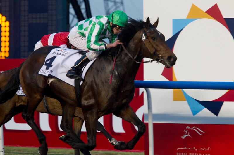 Dubai, United Arab Emirates - March 30 2013 -  Lines of Battle (4), ridden by Ryan Moore, trained by Aiden O'Brien and owned by Mr. Joseph Allen wins UAE Derby against Elleval (2), ridden by Fergal Lunch, trained by David Marnane and owned by Damian Lavelle at the UAE Derby race at the Meydan Racecourse at the annual Dubai World Cup. (Razan Alzayani / The National)