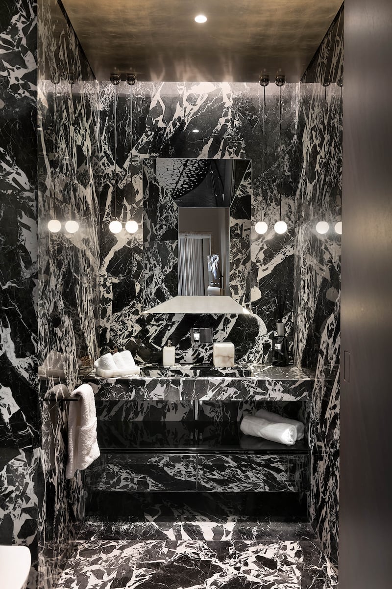 A marble-decorated bathroom.