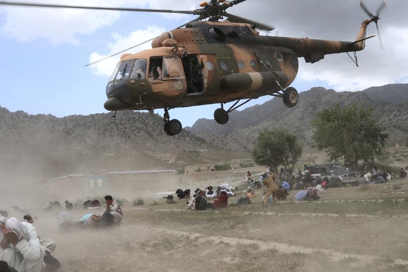 A Taliban helicopter takes off after bringing aid to Gayan. Reuters