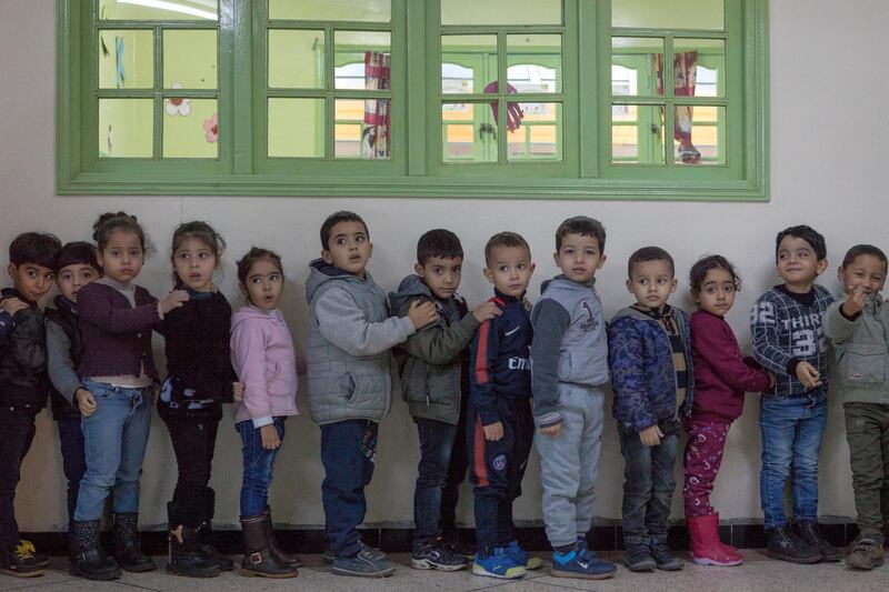 Moroccan children wait in line to attend a kindergarten class, in Sidi Moumen, a low-income suburb of Casablanca.