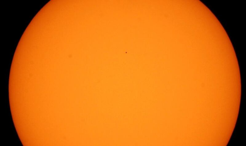View of the transit of the planet Mercury, which is observed tiny (black dot above), in front of the Sun, from the Lunaria planetarium in the city of Guadalajara, Jalisco state, Mexico.  EPA