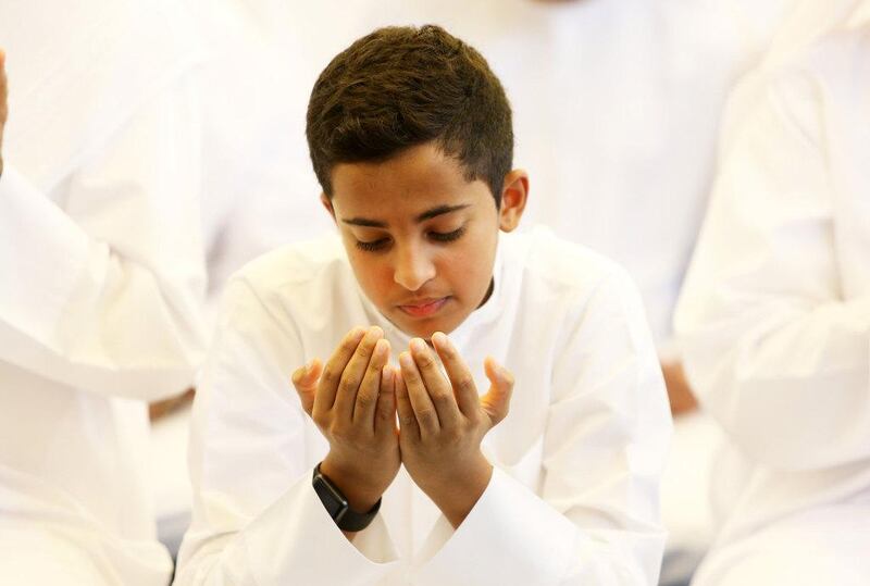 A boy prays at Zabeel Mosque in Dubai. Pawan Singh / The National