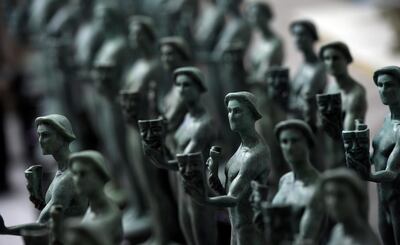 FILE - Finished Actor statuettes are displayed during the 25th annual Casting of the Screen Actors Guild Awards at American Fine Arts Foundry on Jan. 15, 2019, in Burbank, Calif. The SAG Awards announced Wednesday, Jan. 13, 2021, that the 27th annual ceremony has been moved to April 4. The awards had been originally scheduled to air March 14, but shifted to a different date to avoid conflict with the Grammys. (Photo by Chris Pizzello/Invision/AP, File)