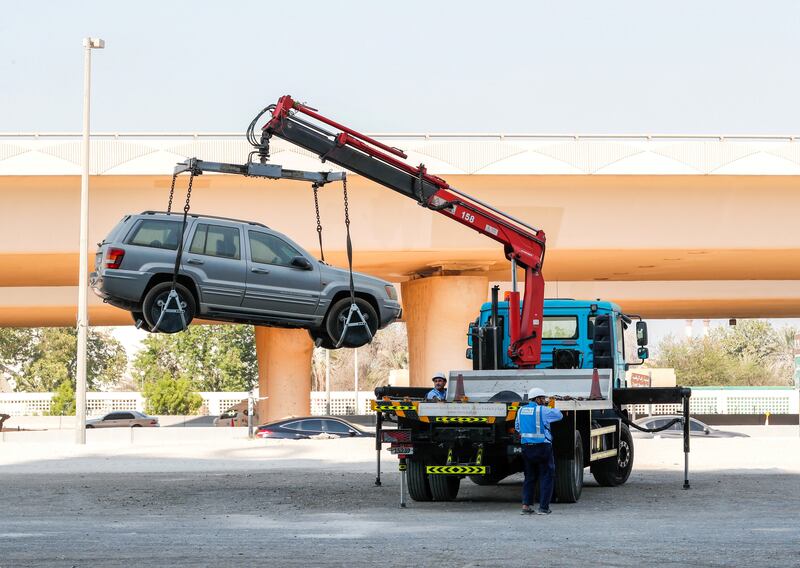 Abu Dhabi, U.A.E., September 26, 2018.  
Cars being towed by Mawaqif wreckers at the sand parking lot infront of Twofour54 Building 6.
Victor Besa / The National
Section:  NA
Reporter: