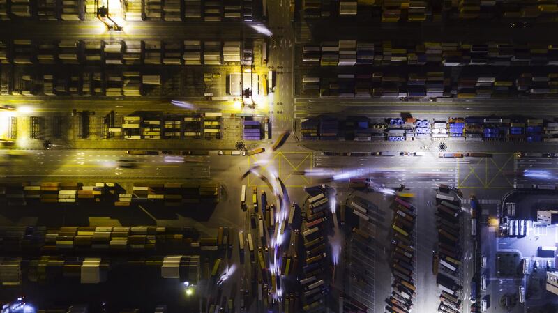 Light trails left by trucks at a port in Shanghai, China. Bloomberg