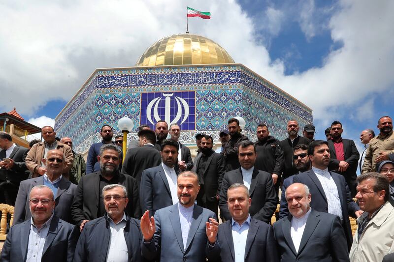 Iranian Foreign Minister Hossein Amirabdollahian visits the village of Maroun El-Rass on the Lebanon-Israel border with Hezbollah members and lawmakers on Friday. AP Photo