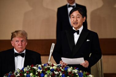 US President Donald Trump (left) listens as Japan's Emperor Naruhito speaks during a state banquet at the Imperial Palace in Tokyo. AFP