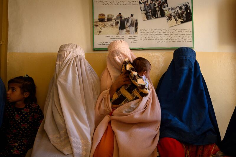 But how does this affect maternity care in Afghanistan? Here, women wait with their children at a government-run maternity clinic in a rural area of Dand district in Kandahar province.