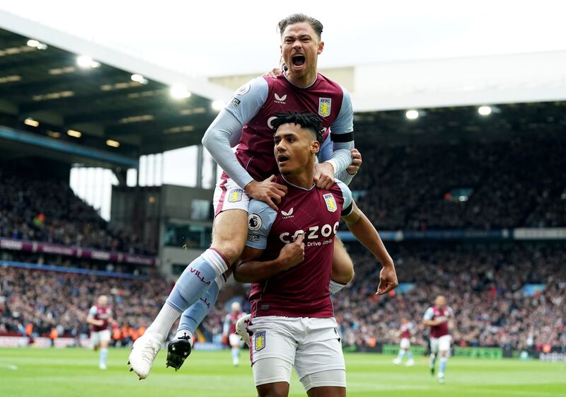 Villa's Ollie Watkins celebrates scoring the opening goal with Matty Cash (top). PA