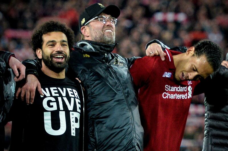 epa07554695 (L-R) Liverpool's Mohamed Salah, head coach Juergen Klopp and Virgil van Dijk celebrate after winning the UEFA Champions League semi final second leg soccer match between Liverpool FC and FC Barcelona in Liverpool, Britain, 07 May 2019. Liverpool won 4-3 on aggregate.  EPA/PETER POWELL