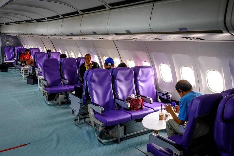 Visitors drinking coffee in the economy class seats in a retired Airbus 330 air-plane turned into a coffee shop at an attraction site, outside Pattaya in Chonburi province. With millions around the world stuck at home due to the pandemic, "plane cafes" in Thailand are offering customers the chance to pretend they are in the sky -- and the idea seems to have taken off.  AFP