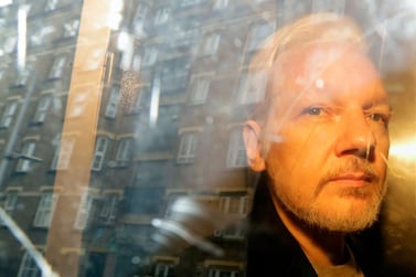 WikiLeaks founder Julian Assange is taken from court. AP