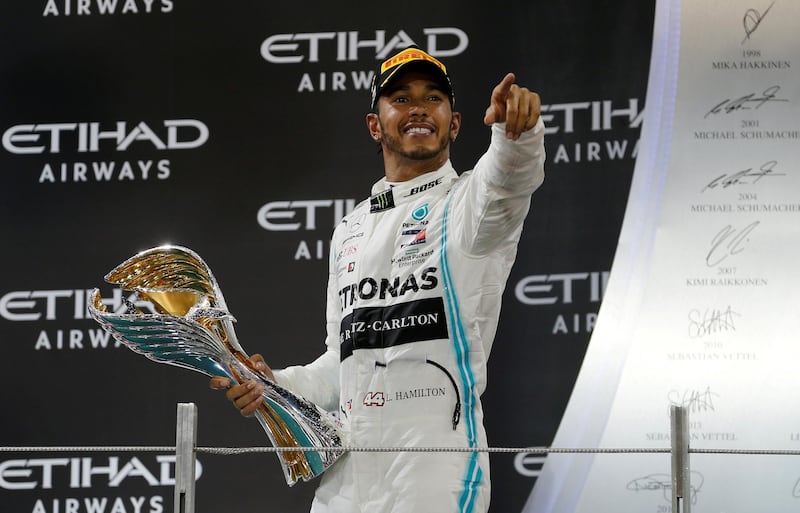 Lewis Hamilton celebrates after winning last season's Abu Dhabi GP. Reuters