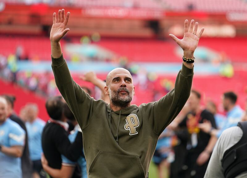 Manchester City manager Pep Guardiola celebrates after winning the FA Cup final at Wembley Stadium on June 3, 2023. PA