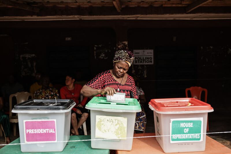 A voter casts her ballot at a polling station in Amatutu during Nigeria's presidential election. AFP