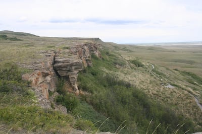 The jump site at Head-Smashed-In Buffalo Jump in Canada commemorates the lives of the indigenous people of Blackfoot culture. Getty Images 