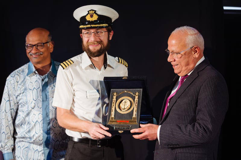 Port Said Governor Adel El Ghadban presents a welcome gift to Logos Hope Captain James Berry. Also pictured is Logos Hope East Asia-Pacific partnership director Edward David.