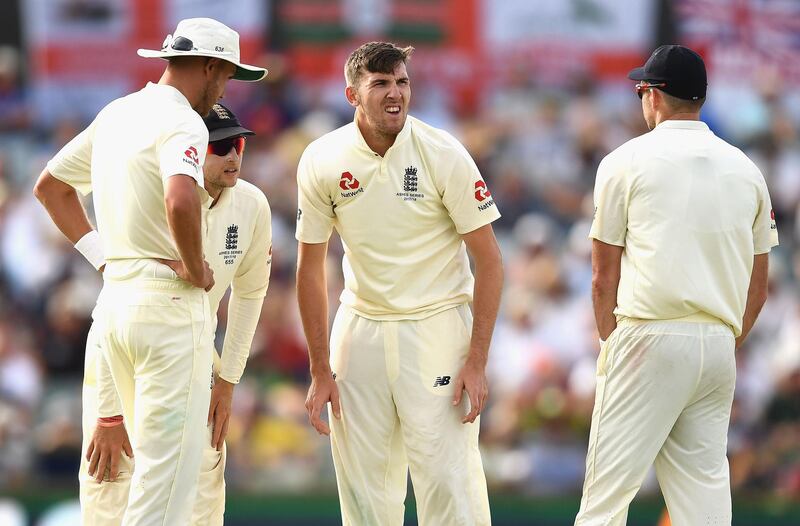 PERTH, AUSTRALIA - DECEMBER 15:  Craig Overton of England grimaces after injuring his side during day two of the Third Test match during the 2017/18 Ashes Series between Australia and England at WACA on December 15, 2017 in Perth, Australia.  (Photo by Quinn Rooney/Getty Images)