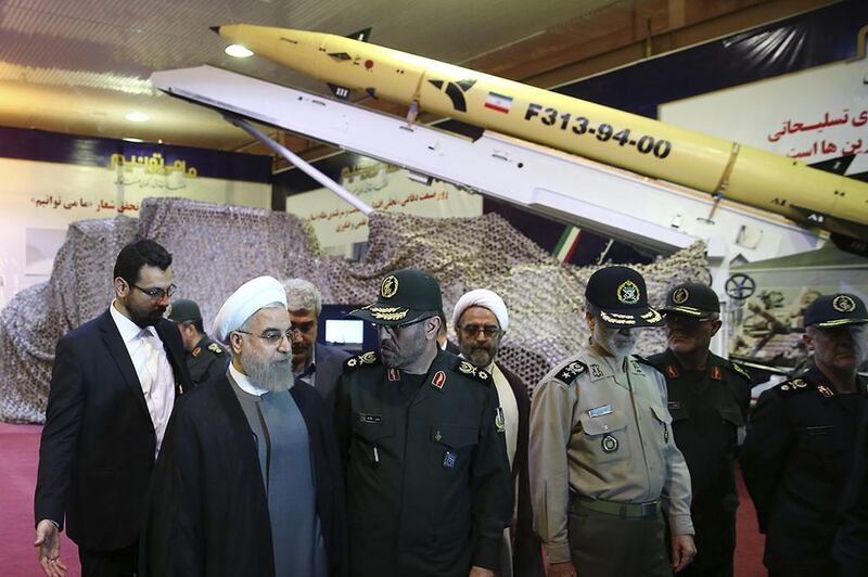 In this photo released by the official website of the office of the Iranian Presidency on August 22, Iran's President Hassan Rouhani unveils the surface-to-surface Fateh-313 in a ceremony marking Defense Industry Day. AP 