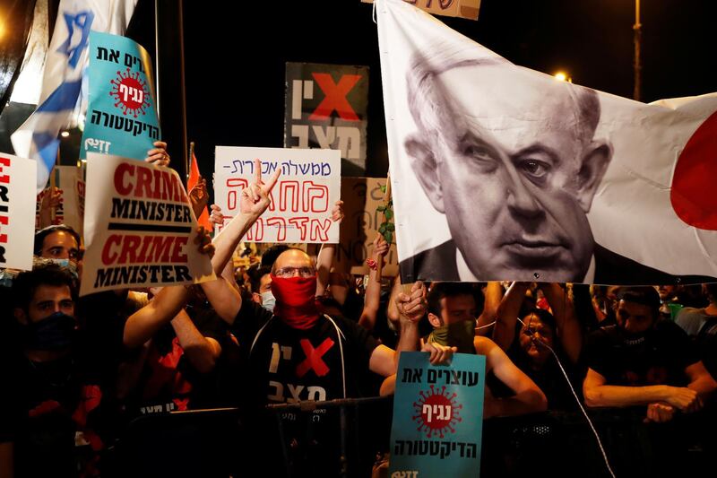 Israelis protest against Israeli Prime Minister Benjamin Netanyahu and his government's response to the financial fallout of the coronavirus disease (COVID-19) crisis outside Netanyahu's residence in Jerusalem. REUTERS