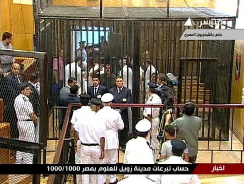 Former Egyptian President Hosni Mubarak is wheeled out of the courtroom for a court recess during his trial at the Police Academy in Cairo in this still image taken from video August 3, 2011. Egypt's Hosni Mubarak was shown wheeled into a cage in court in Cairo on Wednesday with his two sons and other defendants to stand trial for his role in the killing of protesters, state television images showed. REUTERS/Egypt TV via Reuters TV (EGYPT - Tags: CRIME LAW POLITICS CIVIL UNREST) FOR EDITORIAL USE ONLY. NOT FOR SALE FOR MARKETING OR ADVERTISING CAMPAIGNS. THIS IMAGE HAS BEEN SUPPLIED BY A THIRD PARTY. IT IS DISTRIBUTED, EXACTLY AS RECEIVED BY REUTERS, AS A SERVICE TO CLIENTS. EGYPT OUT. NO COMMERCIAL OR EDITORIAL SALES IN EGYPT *** Local Caption ***  LONX111_EGYPT-MUBAR_0803_11.JPG