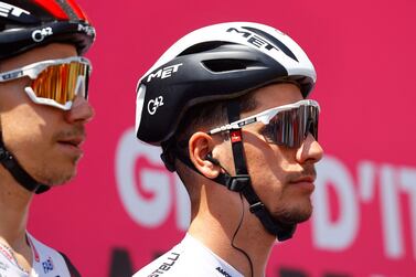 Team UAE Emirates' Portuguese rider Joao Almeida (R) attends the teams presentation prior to the start of the 13th stage of the Giro d'Italia 2022 cycling race, 150 kilometers from San Remo to Cuneo, northwestern Italy, on May 20, 2022.  (Photo by Luca Bettini  /  AFP)