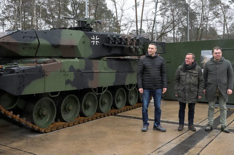 Ukrainian former professional boxer Wladimir Klitschko, German Defence Minister Boris Pistorius and Ukrainian Ambassador to Germany Oleksii Makeiev pose in front of a Leopard 2 A6 tank . Reuters