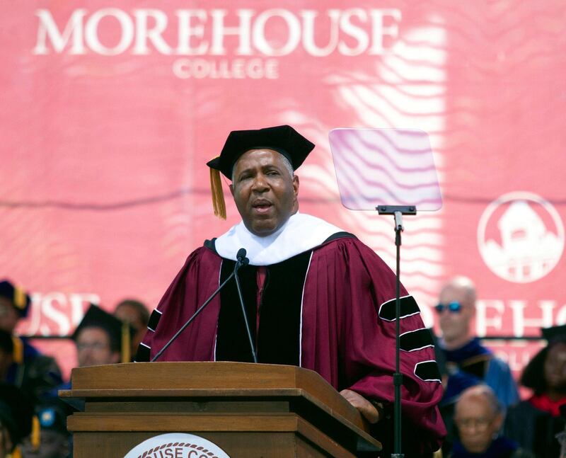 Billionaire technology investor and philanthropist Robert F. Smith announces he will provide grants to wipe out the student debt of the entire 2019 graduating class at Morehouse College in Atlanta, Sunday, May 19, 2019. (Steve Schaefer/Atlanta Journal-Constitution via AP)